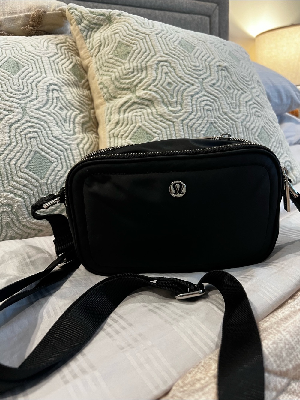 Lululemon Crossbody Camera Bag 2L in black with silver hardware
